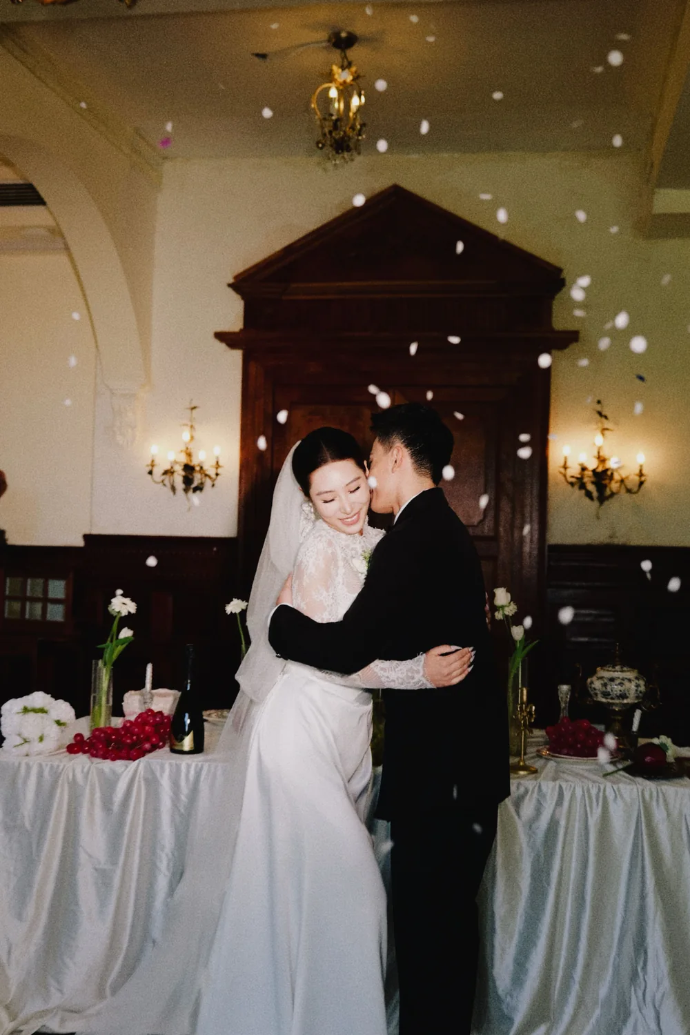 Newlyweds sharing a first dance as confetti falls